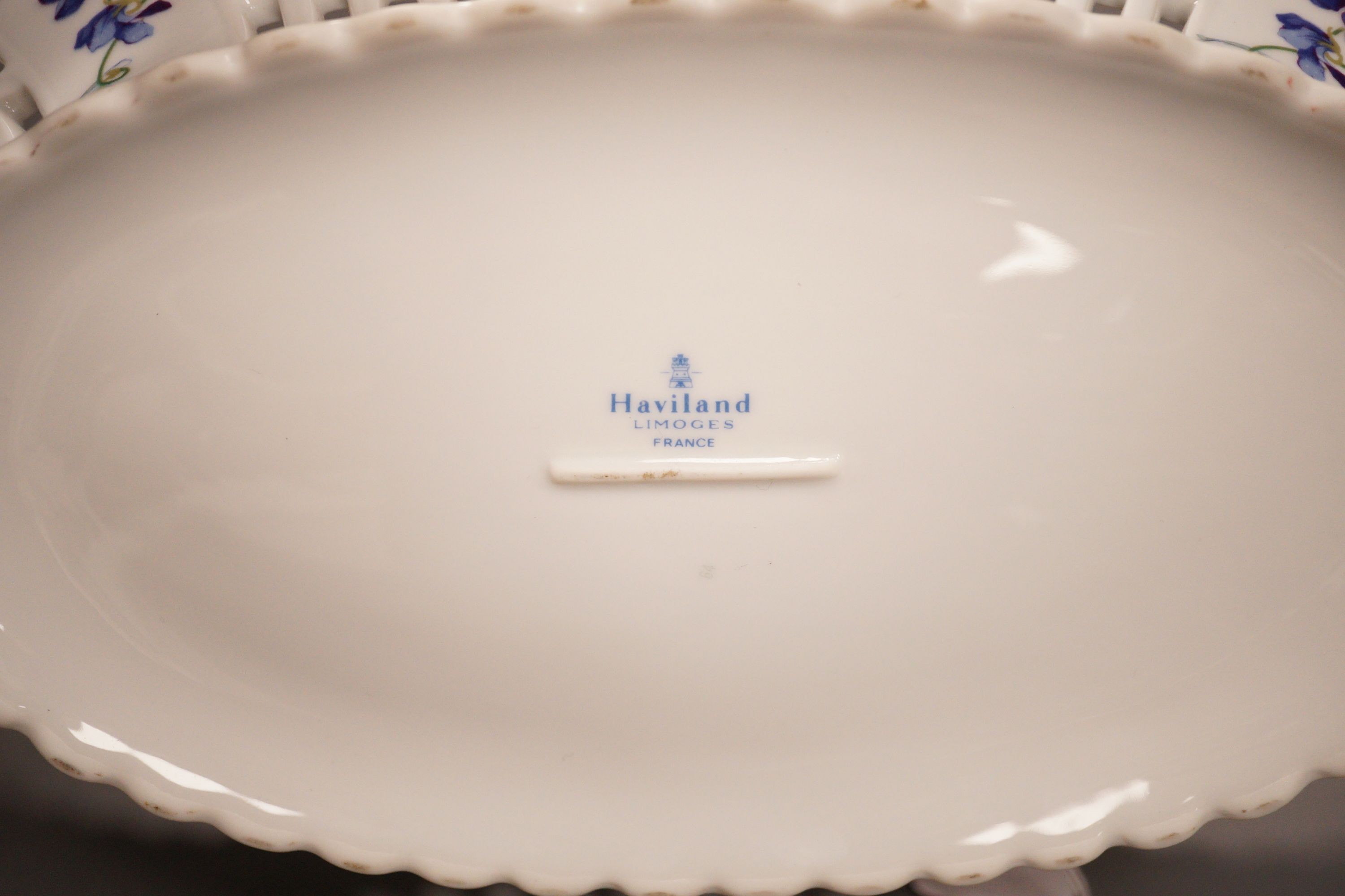 A Haviland Limoges fruit basket, painted with trailing flowers, 41cm